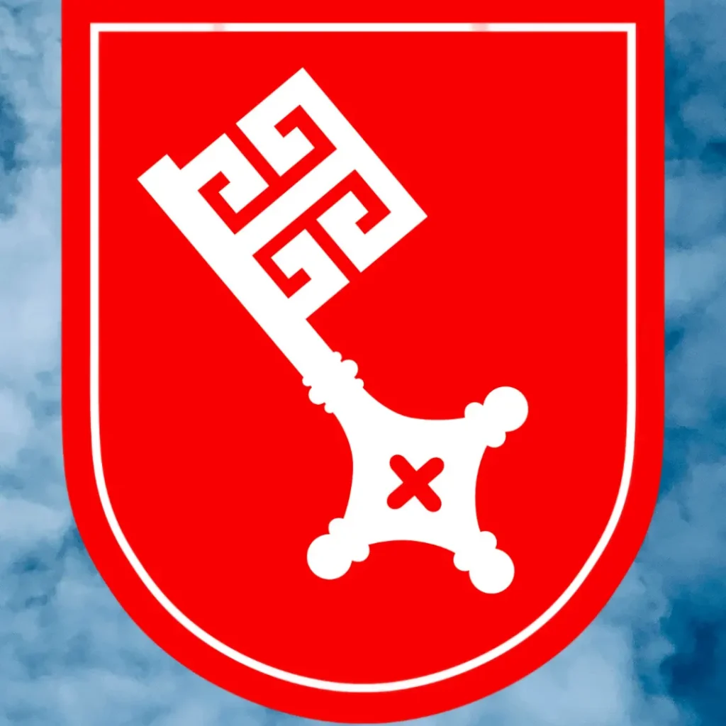 Das Bild zeigt das Wappen der Freien Hansestadt Bremen. Im Hintergrund bleu-weißer Himmel sichtbar.